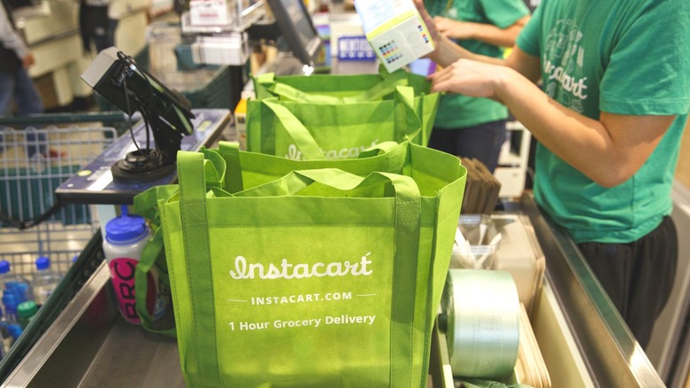 Instacart shopping bags at a grocery store
