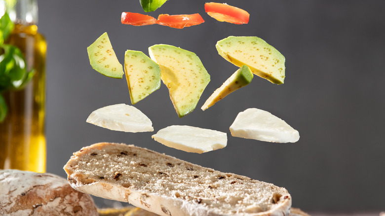 Ingredients falling onto slice of bread