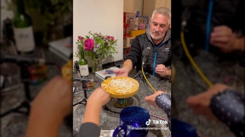 Paul Hollywood about to cut into a tarte