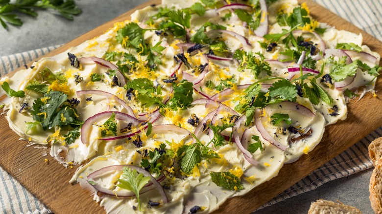 Butter board with herbs and onions