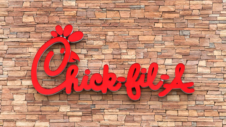 Chick-fil-A sign on a brick wall