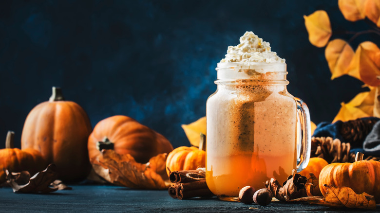 Pumpkin spice beverage with pumpkins