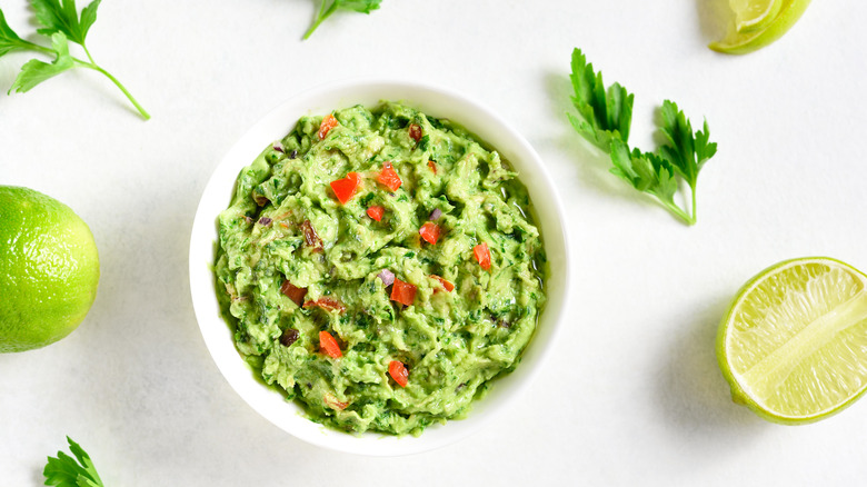 Guacamole dip in white bowl