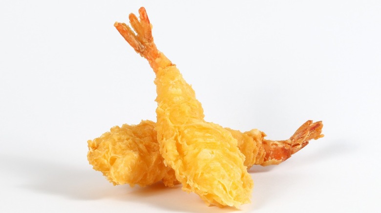 Fried shrimp against a white background