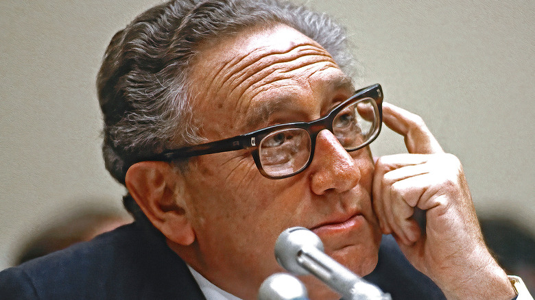 Henry Kissinger with microphone