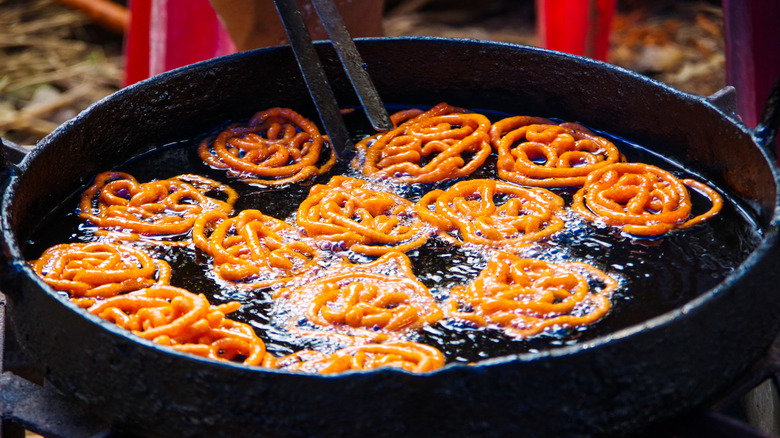 Jalebi frying in pan