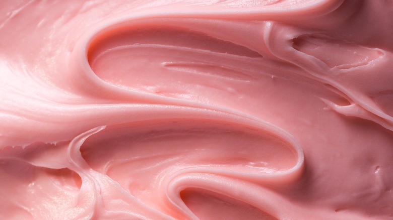 close up whipped pink frosting