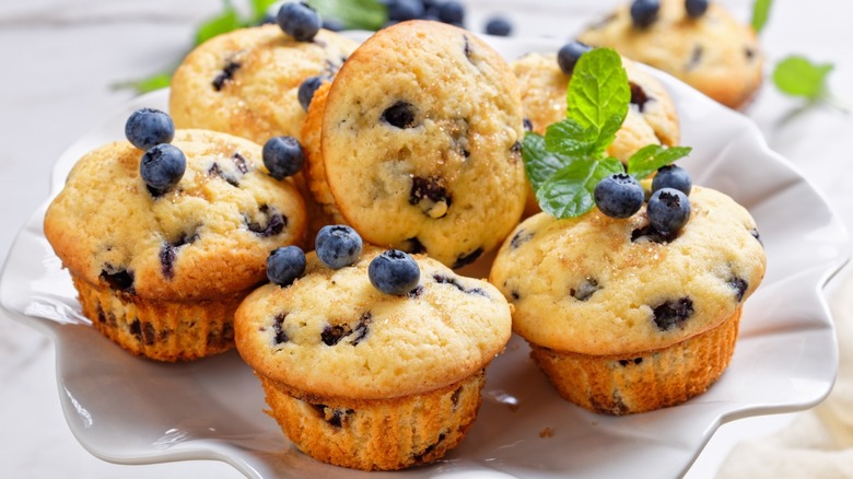 Blueberry muffins and fresh blueberries