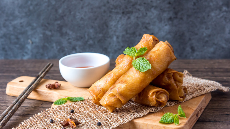 Spring rolls on a wood platter