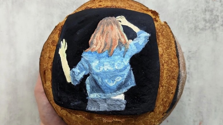 person painted on a loaf of bread