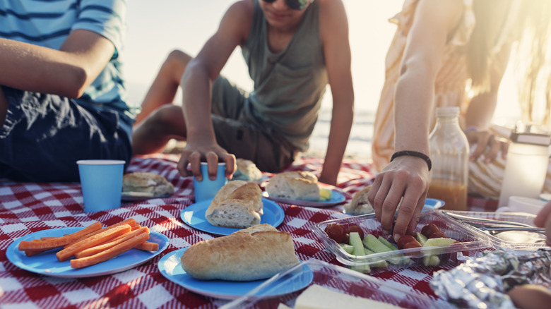 People eating snackes at the beach