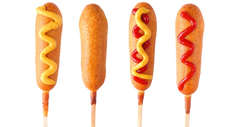 corn dogs with different toppings