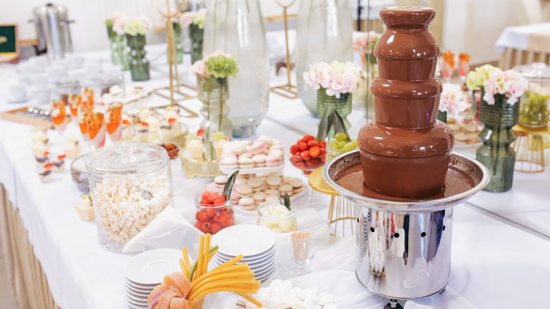 A buffet of desserts and sweets featuring a chocolate fountain.