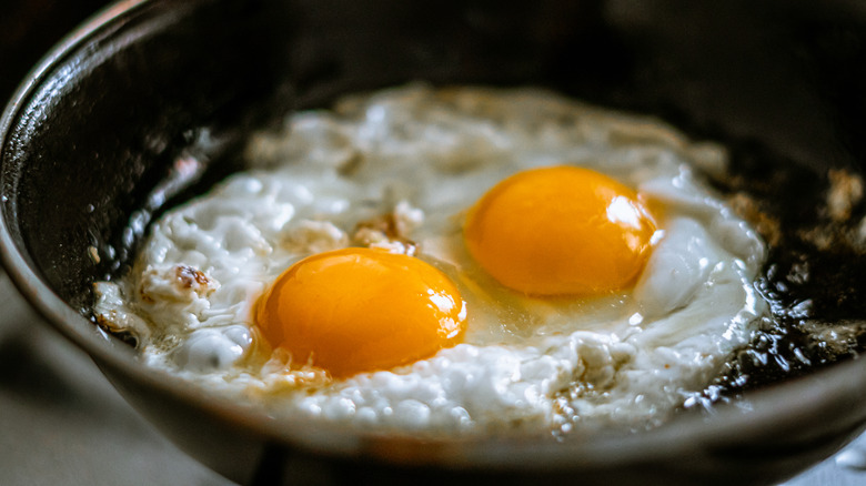 Fried eggs in a pan.