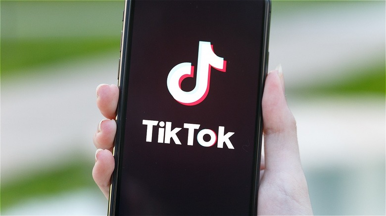 TikTok logo on a phone screen