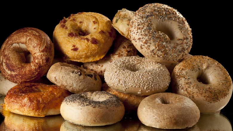 different flavors of bagels in a pile