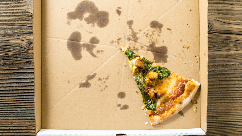 Leftover pizza in cardboard box