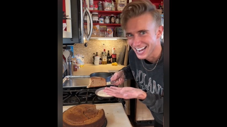 TikToker B. Dylan Hollis presenting the pinto bean cake to his audience 