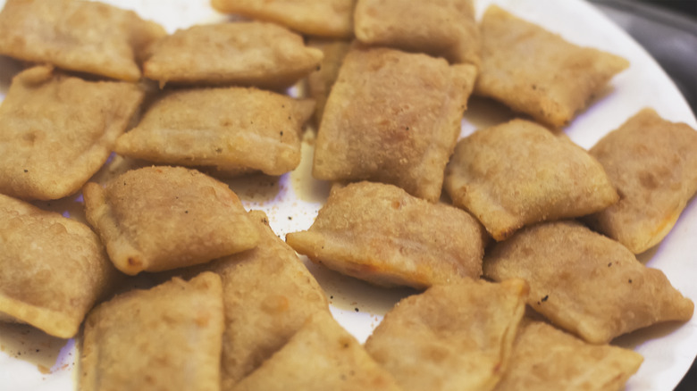 close up on plate of pizza rolls