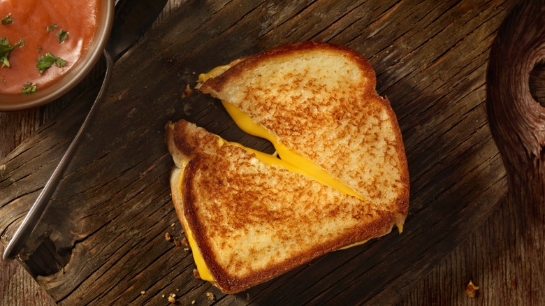 Grilled cheese sandwich on wooden cutting board