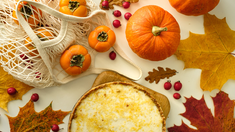 cheesecake with pumpkins and fall leaves