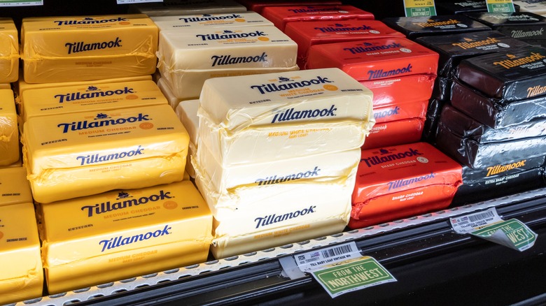 Tillamook cheese stacked on shelf