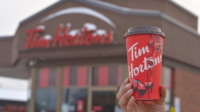 Tim Hortons storefront and coffee cup