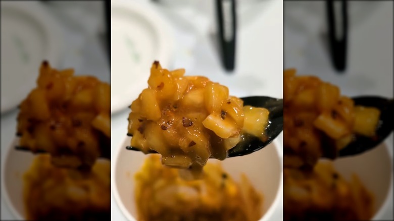 A forkful of Costco kimchi made with condiments from the food court.