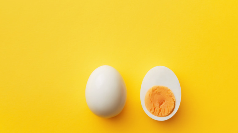 sliced egg on yellow background