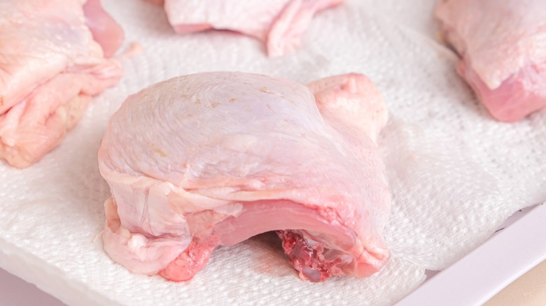 chicken thighs on paper towel
