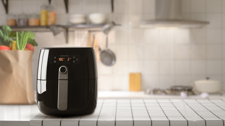 black air fryer on kitchen counter