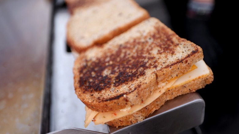 Grilled cheeses being cooked