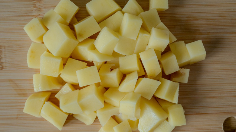 Diced potatoes on cutting board