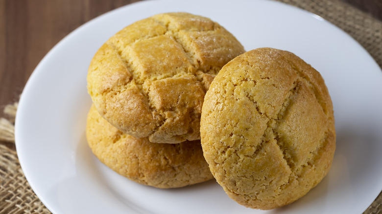 Three cornbread cookies on a plate