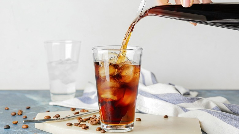 Pouring coffee over ice