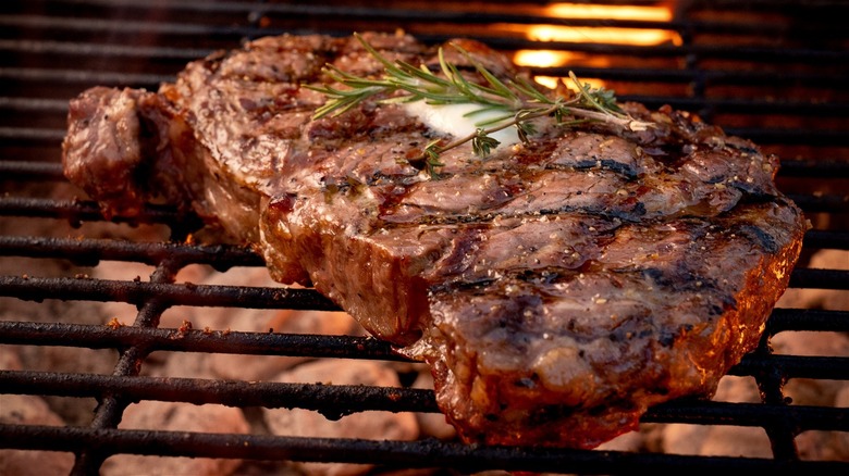 steak cooking on grill