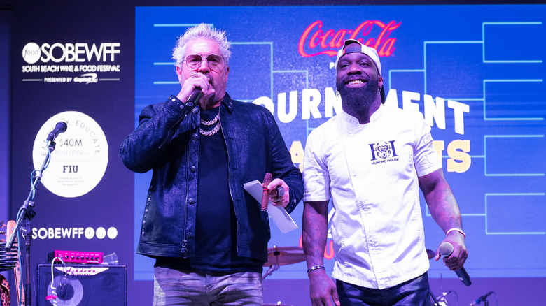Food Network personalities Guy Fieri and Tobias Dorzon at the South Beach Wine and Food Festival