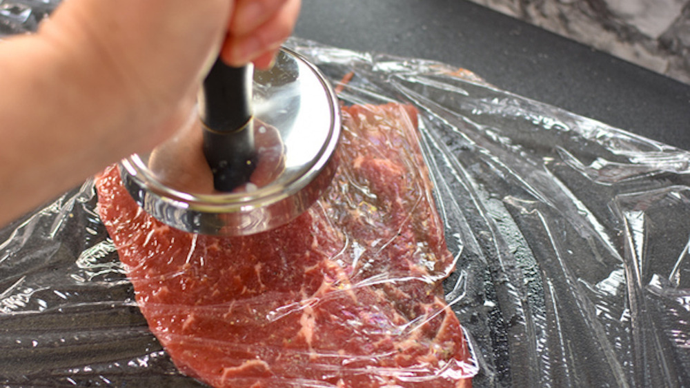 pounding steak flat for torta
