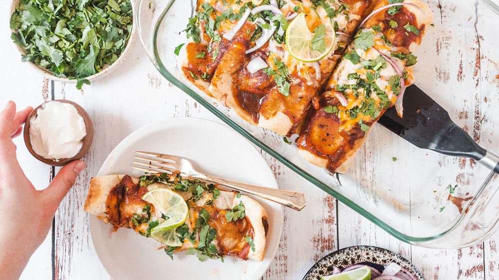 flour tortillas topped with ingredients for chicken fajitas