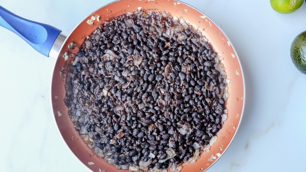Refried beans cooking in pan