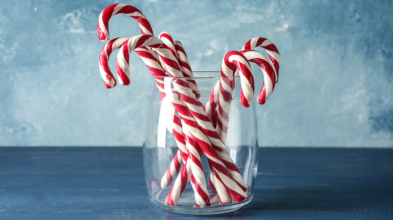 Candy canes jar blue background