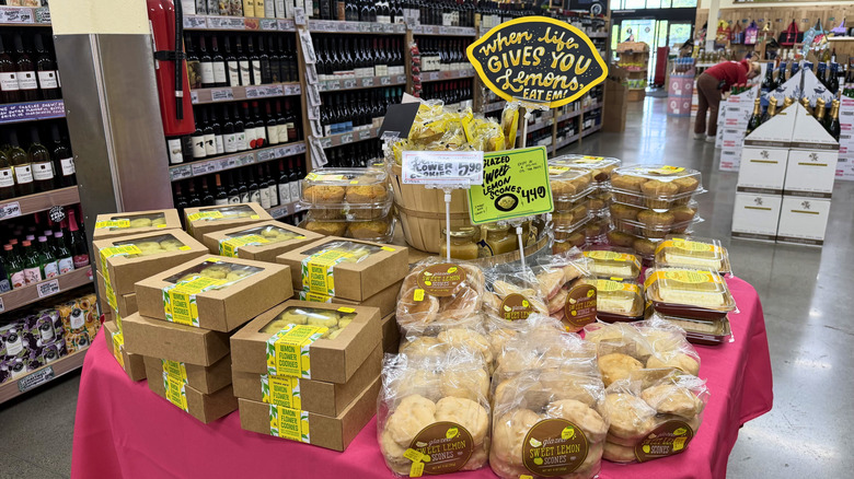 Trader Joe's lemon poppy seed muffins on a display with other lemon-flavored bakery items.