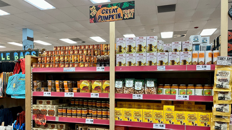 A fall display at Trader Joe's shows off multiple fall products and has a sign reading, 