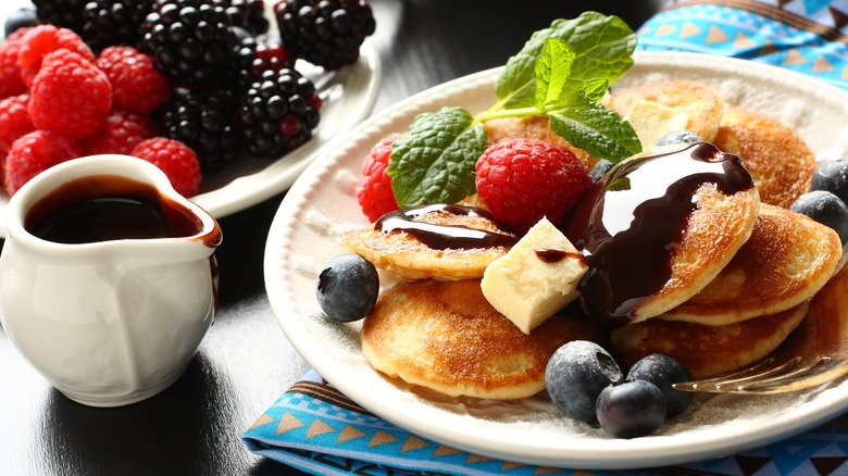 Poffertjes with berries and chocolate sauce