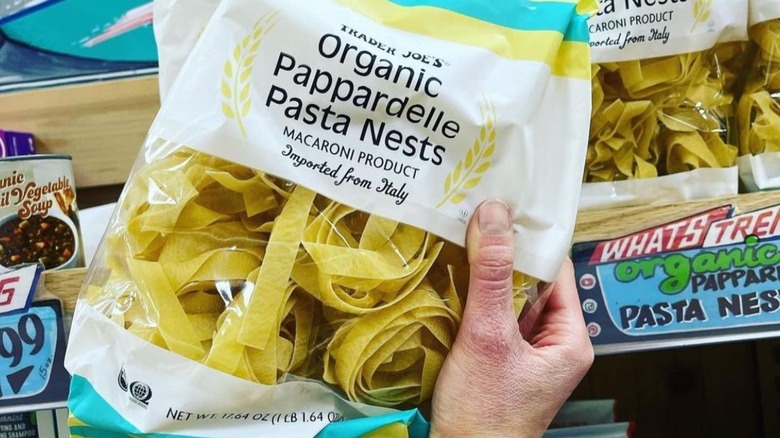 Hand holding Trader Joe's pasta