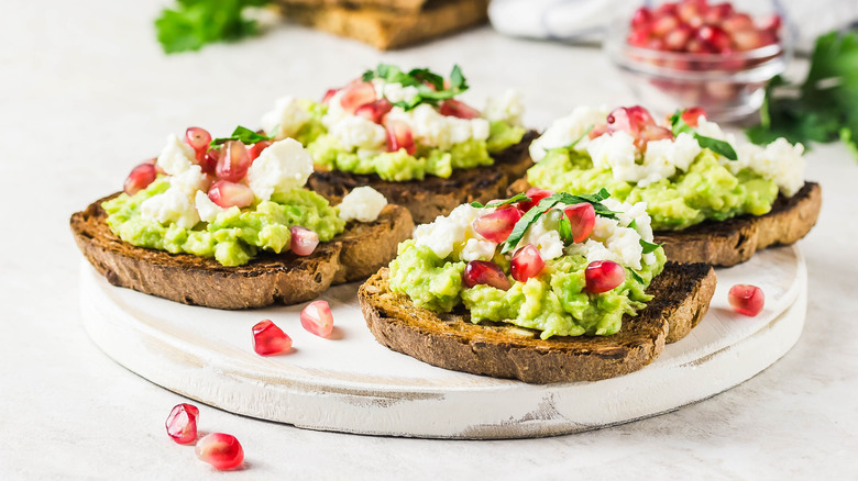 pomegranate seeds on toast