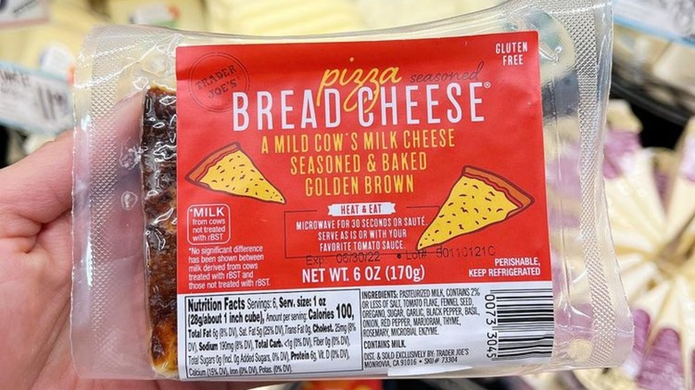 Holding Trader Joe's Pizza Bread Cheese