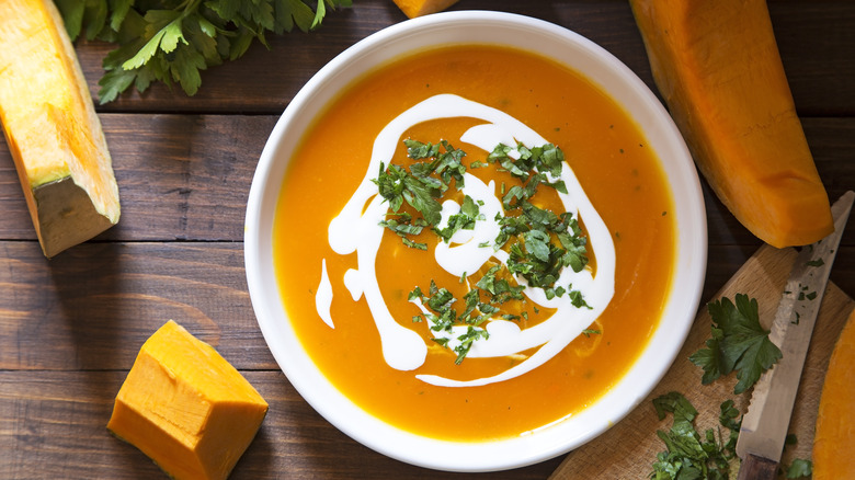 Pumpkin soup surrounded by ingredients
