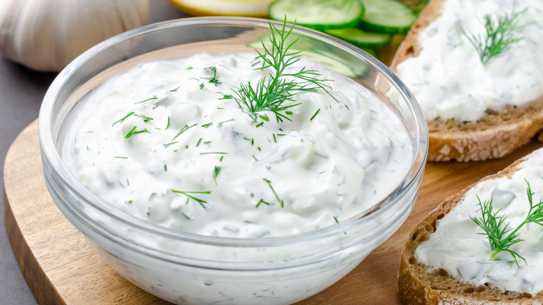 Dill dressing in bowl with bread int he background