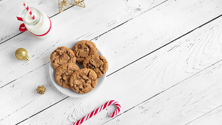 Cookies on plate next to candy cane